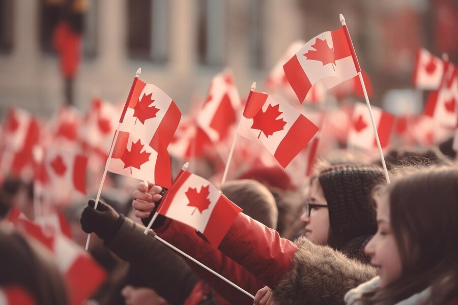 crowd-people-holding-flags-waving-canadian-flag_863013-21159